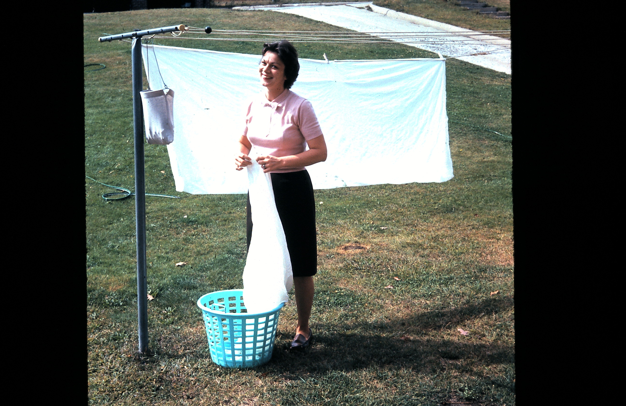 Circa mid 1950s. I wonder if she had a pot of spaghetti simmering ...