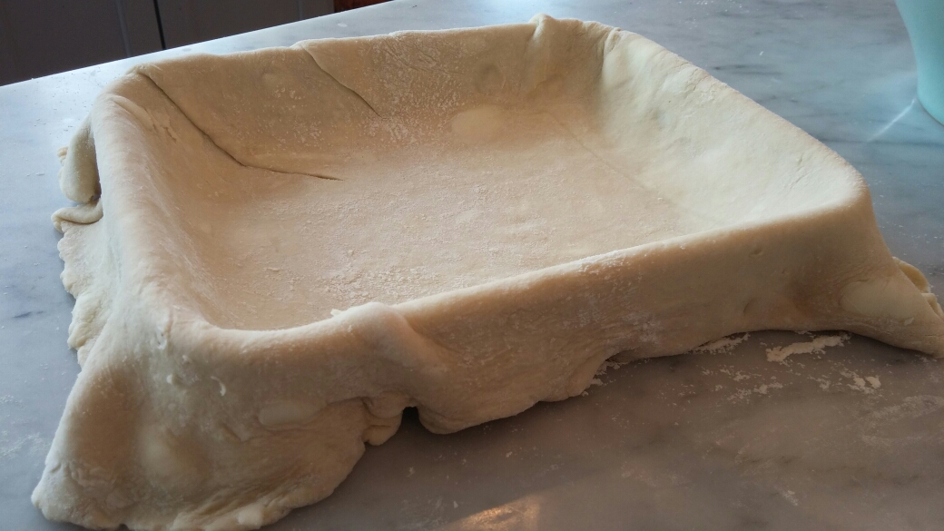 Dough draped over the 9 x 7 dish