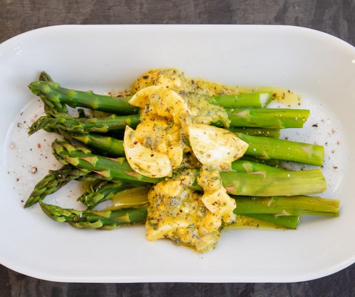 Gribriche sauce on steamed Asparagus from above