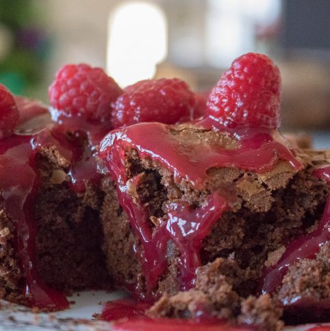 Stack of brownies c raspberry sauce