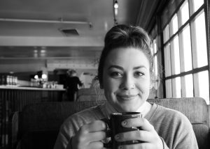 portrait of a young girl in a waterfront cafe